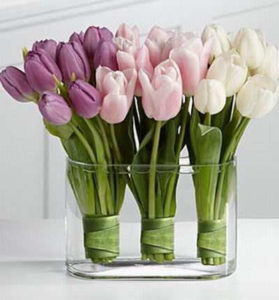 A beautiful deco mix of 10 purple, 10 pink and 10 white tulips in a rectangular vase.