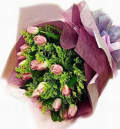 Hand tied bouquet of 15 pink tulips and greenery.