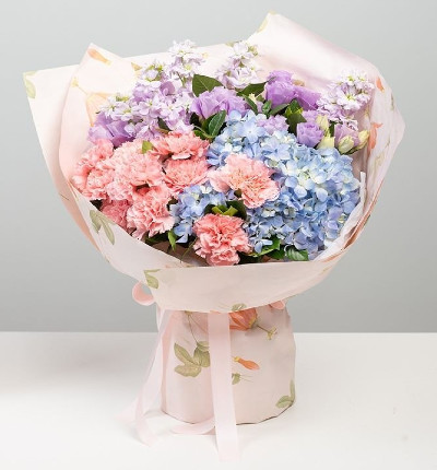 Violet + Lisianthus + 10 pink carnations + a blue hydrangea. Wrapping paper will vary based on availability.