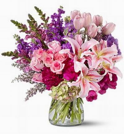 8 pink Roses, 4 pink Lily buds, 5 pink and 5 purple Tulips with Larkspurs and fillers.