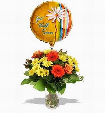 3 orange Gerbera Daisies,  yellow Chrysanthemum, Hypericum Berries, leaves and helium balloon. If balloons are unavailable it will be substituted with a 15cm teddy bear.