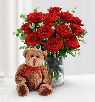 12 roses with a 20cm teddy bear. Teddy bears may vary based on availability.