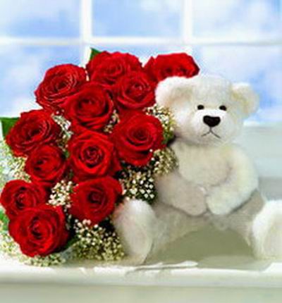 12 roses with a 20cm white teddy bear. Teddy bears may vary based on availability.