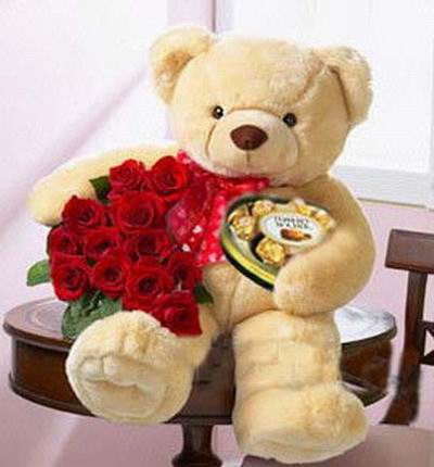 12 roses with a 45 cm teddy bear and box of chocolates. Teddy bears may vary based on availability.