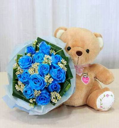 12 blue color roses with Snow in Summer fillers and a small 20cm teddy bear. Teddy bears may vary based on availability.
