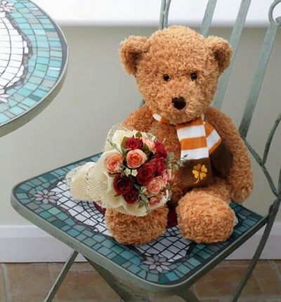 6 red and 6 pink Roses and greenery with a 20cm Teddy bear.  Teddy bears may vary based on availability.