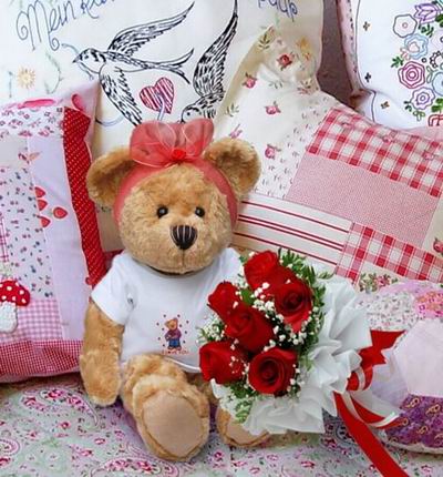 6 Roses and Baby's Breath with a 20cm Teddy bear.  Teddy bears may vary based on availability.
