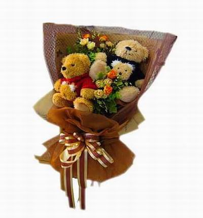 Three 6cm Teddy Bears with flower fillers in hand-tied bouquet wrapping. Teddy bear may vary based on availability.