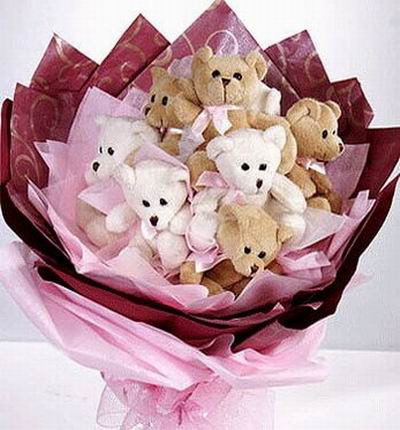 Seven 10cm Teddy Bear bouquet. Teddy bear may vary based on availability.