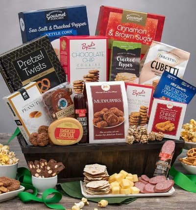 This seemingly endless snack basket is guaranteed to please a crowd, or satisfy your loved one through a time of need. This unique lattice basket is packed to the brim with delightful snacks such as cheese straws, kettle corn and nougat. The treats wouldn't be complete without savory smoked goudah, gourmet sausage and artisan crackers for them to just keep snackin' on!

Includes:
* Cinnamon & Brown Sugar Kettle Corn - 4.2 oz.
* Sea Salt & Cracked Pepper Kettle Corn - 4 oz.
* Chocolate Chip Cookies - 4 oz.
* Chocolate Cubetti Wafer Cookies - 8.8 oz.
* Classic Mini Pretzel Twists - 3 oz.
* Roasted & Salted Peanuts - 2 oz.
* Mudpuppies - 5.5 oz.
* Sea Salt & Cracked Peppercorn Water Crackers - 4 oz.
* Blueberry Pomegranate Trail Mix Crunch - 1 oz.
* Peanut Butter Chocolate Chip Cookies - 2 oz.
* Traditional Cheese Cheese Straws - 1 oz.
* Summer Sausage - 5 oz.
* Almondina Choconut� Biscuits - 4 oz.
* Smoked Gouda - 4 oz.