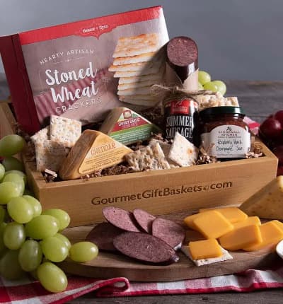 Our decadent spread of sausage, cheese, crackers and jam is perfect for a summer picnic, cozy winter night indoors, or just about any time! This elegant gift can be paired with your favorite fruit and wine, it also has everything you need to enjoy all on its own!

Includes:
* Stoned Wheat Crackers - 4 oz.
* Summer Sausage - 5 oz.
* Savory Garlic Cheddar Cheese - 2 oz.
* Spicy Cheddar & Veggie Cheese - 2 oz.
* Raspberry Peach Champagne Jam - 4 oz.