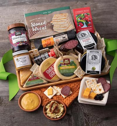 This artisan meat and cheese platter features all sorts of bright, savory, sweet, and bold flavors. Our extravagant basket includes everything from Monterey jack jalapeno cheese, to artichoke bruschetta, delightful summer sausage, sweet cherry candies and so much more!

Includes:
* Savory Garlic Cheddar Cheese - 2 oz.
* Cheddar Cheese - 2 oz.
* Monterey Jack Jalapeno Cheese - 4 oz.
* Ultra Sharp Cheddar Cheese - 4 oz.
* Mixed Berry Preserves - 12.3 oz.
* Stoned Wheat Crackers - 4 oz.
* Sun Dried Tomatoes - 7.9 oz.
* Artichoke Bruschetta - 7.9 oz.
* Hot and Sweet Mustard - 4 oz.
* Summer Sausage - 5 oz.
* Smoked Pepperoni - 6 oz.
* Cherry Buds Hard Candies - 1.75 oz.