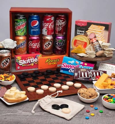 Bring family game night right to your home with this perfect gift set that has it all! With a delicious assortment of sweet and savory snacks as well as soda and candy, there's something here for everyone. Relax and enjoy a game of checkers with your loved ones, and then pack it all up in the convenient gift crate when you're done!

Includes:
* Checkers - 1 Game (board, pieces & satchel)
* Soda (Pop) - 8 cans
* Peanut Butter Chocolate Chip Cookies - 4.2 oz.
* (4) Theater Box Candies - 3.1 oz. each
* Stoned Wheat Crackers - 4 oz.
* (2) Cheddar Cheese - 2 oz.
* Smoked Gouda - 4 oz.
* Summer Sausage - 5 oz.
* Checker Board Crate