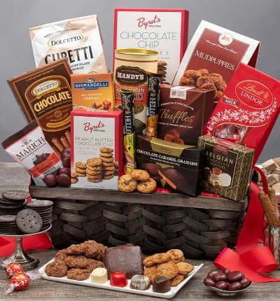 This grand gourmet basket is every chocolate lovers dream come true! We've compiled our most beloved chocolate delicacies and essentials to make this luxury gift basket. The lucky recipient won't be able to resist chocolate caramel grahams, red velvet cookies, mudpuppies, french chocolate truffles, and oh so much more!

Includes:
* Chocolate Chip Cookies - 4 oz.
* Mudpuppies - 5.5 oz.
* Milk Chocolate Truffle Gift Bag - 5.1 oz.
* Peanut Butter Chocolate Chip Cookies - 2 oz.
* Chocolate Covered Cherries - 2.3 oz.
* French Chocolate Truffles - 3.5 oz.
* Salted Caramel Bar - 1.4 oz.
* Cookies & Cream Bar - 1.4 oz.
* Chocolate Caramel Grahams - 2.6 oz.
* Belgian Chocolates - 1.76 oz.
* Dark Chocolate Cookie Thins - 4.6 oz.
* Caramel filled Milk Chocolate Bar - 3.5 oz.
* Cubetti Wafer Cookie Bag - Chocolate - 8.8 oz.
* Dolcetto Chocolate Wafer Rolls - 4.4 oz.