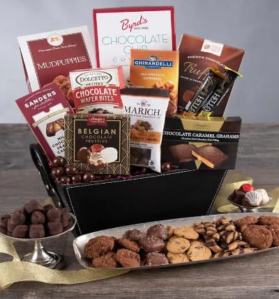 Chocolate goodies in wonderous abundance will greet your lucky friend, client, or sweetheart when you send them the Chocolate Decadence Gift Basket. Available for next day delivery, this posh assortment of truffles, chocolates, cookies, caramels, wafers and other sweets will bring a beaming smile to their face!

Includes:
* Chocolate Chip Cookies - 4 oz.
* Mudpuppies - 5.5 oz.
* French Chocolate Truffles - 3.5 oz.
* Dark Chocolate & Sea Salt Caramel Filled Bar - 3.5 oz.
* Belgian Chocolates - 1.76 oz.
* Chocolate Wafer Petites - .7 oz.
* Milk Chocolate Sea Salt Caramels - 1 oz.
* Chocolate Caramel Grahams - 2.6 oz.
* Salted Caramel Bar - 1.4 oz.
* Cookies & Cream Bar - 1.4 oz.
* English Toffee Caramels - 2.1 oz.