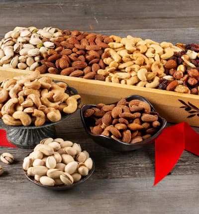 A gourmet assortment of delicious and healthy roasted salted pistachios, cashews and almonds are paired with trail mix in an elegant wooden tray making a thoughtful gift, appropriate for any occasion. Send your love, condolences, congratulations or thanks in a cute and tasty package!

Includes:
* Roasted Salted Pistachios - 6 oz.
* Roasted Salted Cashews - 7 oz.
* Roasted Salted Almonds - 6 oz.
* Trail Mix - 4 oz.
* Wooden Tray