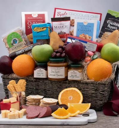 Apples, oranges, sweet caramel, cookies, sausage, cheese, crackers, spreads and candies. Can you think of a better combination to send to a loved one? Whether it's a party platter, picnic kit, token of thanks or welcome home gift, there's something for everyone to love!

Includes:
* 2 Green Apples
* 2 Oranges
* 2 Pears
* 2 Red Apples
* Garlic Summer Sausage - 10 oz.
* Vermont Sharp Cheddar Cheese - 8 oz.
* Sea Salt & Cracked Peppercorn Water Crackers - 4 oz.
* Chocolate Chip Cookies - 4 oz.
* Cheese Straws - 4 oz.
* Nutcakes - 7.2 oz.
* Sea Salt Caramel Cookie Straws - 1 oz.
* Almondina Biscuits - 4 oz.
* Almond Cashew Clusters with Pumpkin Seeds - 1 oz.
* Raspberry Peach Champagne Jam - 3.75 oz.
* Maine Maple Champagne Mustard - 3.5 oz.
* Sea Salt Caramel Sauce - 12.25 oz.
* Assorted Candy Citrus Slices - 5pc
* Chocolate Covered Cherries - 2.3 oz.
* Keepsake Seagrass Basket