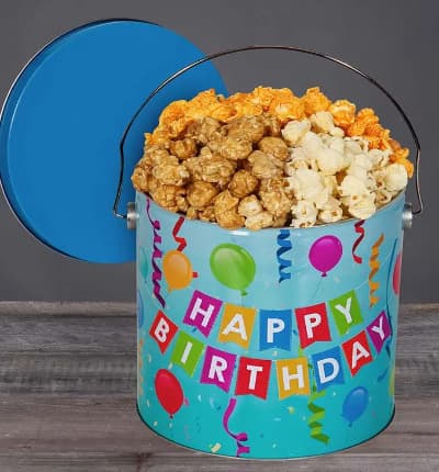 Cheesy cheddar, classic butter, and sweet and salty caramel flavors are the perfect toppings for a beloved snack - popcorn! This Happy Birthday tin includes an assortment of our favorite flavors that the birthday guy or gal is sure to love!

Includes:
* 1 Gallon Popcorn
* Butter
* Caramel
* Cheddar
* Festive Birthday Tin