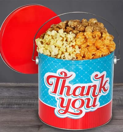 This fun Thank You Popcorn Tin is packed with yummy flavors like cheesy cheddar, luscious butter, and crispy caramel that your recipient is sure to love! This blissfully delicious gift will make their special day extra special!

Includes:
* 1 Gallon Popcorn
* Butter
* Caramel
* Cheddar
* Thank You Tin