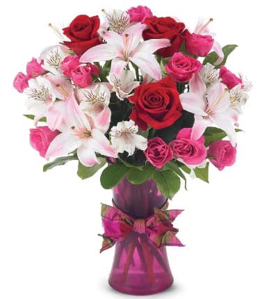 * Red Roses
* Pink Roses
* White Alstroemeria
* Light Pink Lilies
* Colorful Vase with Ribbon