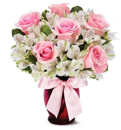 * Pink Roses
* White Alstroemeria
* Pink Fluted Vase
* Decorative Ribbon