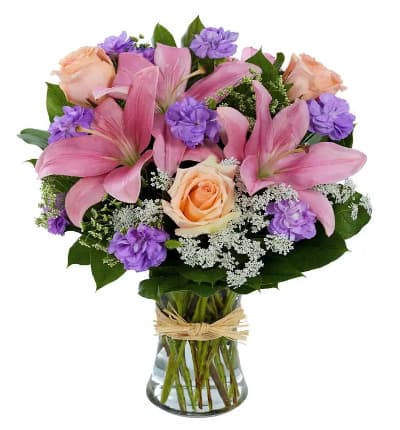 * Pink Asiatic Lilies
* Purple Mini Carnations
* Peach Roses
* Queen Anne's Lace
* Clear Gathering Vase with Raffia