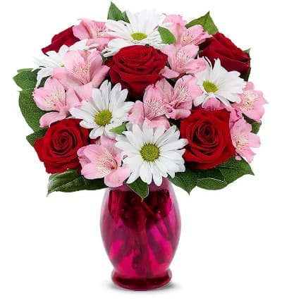 * Red Roses
* Pink Alstroemeria
* White Daisies
* Seasonal Greens
* Pink Fluted Vase