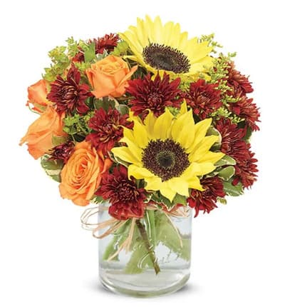 * Sunflowers
* Orange Spray Roses
* Bronze Cushion Poms
* Red Hypericum
* Bupleurum
* Solidago
* Pittosporum
* Clear Glass