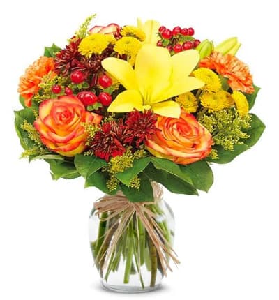 * Yellow Asiatic Lilies
* Orange Roses
* Orange Carnations
* Yellow Button Poms
* Bronze Cushion Poms
* Red Hypericum
* Solidago
* Glass Vase