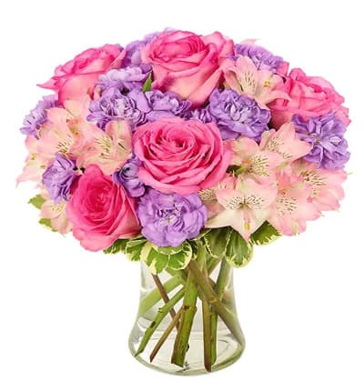 * Pink Alstroemerias
* Hot Pink Roses
* Lavender Mini Carnations
* Pittosporum
* Glass Vase