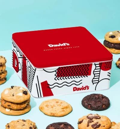 What's better than one pound of delicious fresh baked cookies? How about two pounds! These tasty treats are the perfect Birthday, I love you, or just because gift. These scrumptious Chocolate Chunk, Peanut Butter Chip, Double Chocolate Chunk, Oatmeal Raisin, and Cherry White Chip cookies are baked fresh the same day they are shipped and this tin is packed full with plenty to share! Please note: Flavors may vary depending on availability.

Includes:
* Approximately 24 Cookies
* David's Cookie Tin
* Kosher OU/D certified
* Card Message