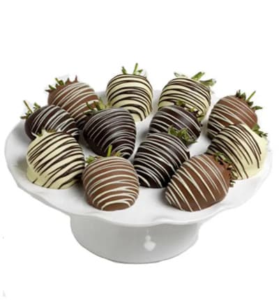 The perfect combination of chocolate and strawberries is presented here to create a delicious treat. Fresh strawberries are hand-dipped in Belgian dark, white and milk chocolates by our Artisans. Each strawberry is artfully decorated with contrasting chocolate drizzles. Available for next day delivery, these One Dozen Chocolate Covered Strawberries make a great gift for celebrating a birthday, anniversary, or holiday.

Includes:
* One Dozen Fresh Strawberries
* Dipped in Milk, White & Dark Chocolate
* Drizzle Decoration

ALLERGEN ALERT: Product contains egg, milk, soy, wheat, peanuts, tree nuts and coconut. We recommend that those with food related allergies take the necessary precautions