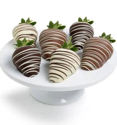 A classic pairing of chocolate and strawberries is presented here in the perfect gift. Succulent juicy strawberries are dipped in real Belgian chocolate to create a delicious treat. Available for immediate delivery, these chocolate covered strawberries are the perfect way to celebrate a birthday, anniversary, or holiday.

Includes:
* Large Fresh Strawberries
* Covered in Milk, White & Dark Chocolate
* Decorative Chocolate Drizzle

ALLERGEN ALERT: Product contains egg, milk, soy, wheat, peanuts, tree nuts and coconut. We recommend that those with food related allergies take the necessary precautions.