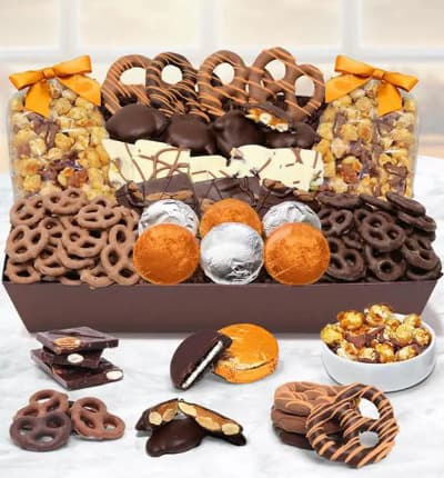 Celebrate Fall with a tray full of chocolate covered goodies! Your recipient will be happy for days munching on all the chocolate covered pretzels, cookies and more!
Includes:
* 6 OREO  Cookies Covered in Belgian Milk Chocolate
* ~4 oz. of Belgian Milk Chocolate Covered Mini Pretzels
* ~4 oz. of Belgian Dark Chocolate Covered Mini Pretzels
* 8 Large Pretzel Twists covered in Milk and Dark Belgian Chocolate
* ~3 oz. Belgian Dark Chocolate Almond Bark
* ~3 oz. Belgian White Chocolate Pistachio Bark
* ~5 oz. Caramel Popcorn drizzled with Belgian Milk Chocolate
* ~5 oz. Caramel Popcorn drizzled with Belgian Dark Chocolate
* 8 Caramel and Cashew Nut Clusters
* Tray Container’

ALLERGEN ALERT: Product contains egg, milk, soy, wheat, peanuts, tree nuts and coconut. We recommend that those with food related allergies take the necessary precautions.
