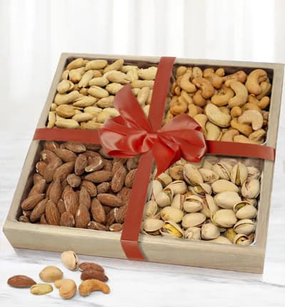 Send one of mankind's favorite snacks! The Fancy Assorted Nuts Tray carries pistachios, almonds, cashews, extra large peanuts on a keepsake wooden gift tray that your recipient will love.

Includes:
* Pistachios
* Almonds
* Cashews
* Extra Large Peanuts
* Wooden Gift Tray