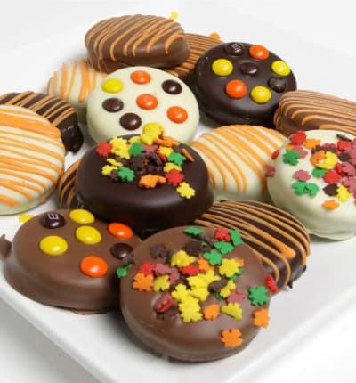 OREO® Cookies are a fantastic treat any day. They are even better when they are dipped in Belgian chocolate and decorated with delicious fall treats. Everything you love about OREOS® will make this gift so sweet for that special someone.
Includes:
* 12 Chocolate Dipped OREO Cookies
* White, Dark and Milk Chocolate
* Topped with Fall Candies.
ALLERGEN ALERT: Product contains egg, milk, soy, wheat, peanuts, tree nuts and coconut. We recommend that those with food related allergies take the necessary precautions.
