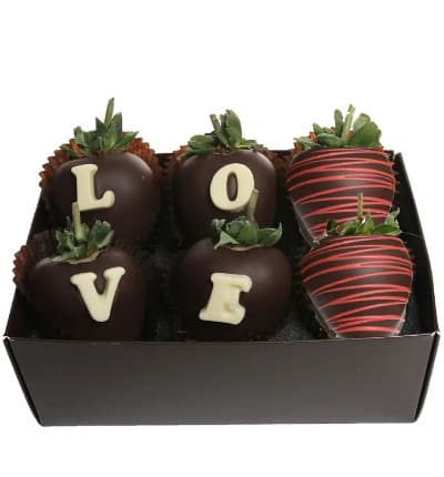 Chocolate Covered Strawberries are the quintessential gourmet Valentine's Day gift and these are the ULTIMATE Chocolate Covered Strawberries. Six fresh and juicy strawberries are hand dipped in Belgian Chocolate and decorated with the letters L-O-V-E making it a beautiful and romantic gift.
Includes:
* Six Strawberries
* Chocolate 'Love' Message
* Dipped in Belgian Chocolate
* Delivered in Gift Box.
ALLERGEN ALERT: Product contains egg, milk, soy, wheat, peanuts, tree nuts and coconut. We recommend that those with food related allergies take the necessary precautions.
