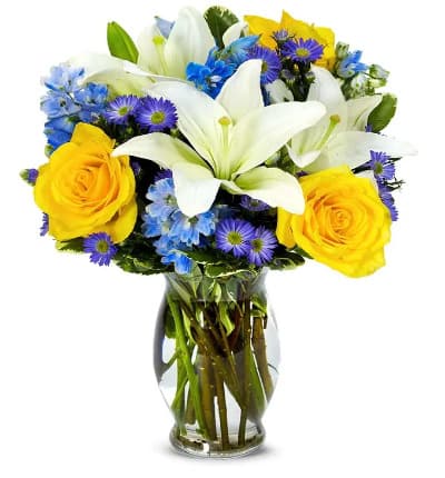 * White Asiatic Lilies
* Yellow Roses
* Blue Delphinium
* Purple Monte Casino