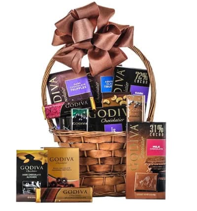 Send sweet chocolaty thoughts to a special person in your life and make it even better by sending this dream basket full of Godiva goodness delivered straight to their door. This gourmet gift delivery will sure to surprise and delight the chocolate lover in your life!

Includes:
* Godiva Dark Chocolate Truffles,
* Godiva Classic Truffles
* Godiva Dark Chocolate & Raspberry Filled Bar
* Godiva Solid Dark Chocolate Bar
* Godiva Solid Milk Chocolate Bar
* Godiva Milk Chocolate Pearls
* Godiva Mint Chocolate Pearls
* Godiva Dark Chocolate Almonds/Cashews
* Godiva Dark Chocolate Covered Pretzels
* Basket