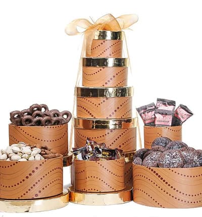 This round gift tower is filled to the brim with chocolates and treats. Makes a perfect gift for the holidays for family, friends or colleagues. Delivered in a beautiful gift tower and finished off with a golden ribbon.

Includes:
* Brix Chocolates
* Chocolate Covered Mini Pretzels
* Bali's Best Coffee Candies
* Pistachios and Almonds
* Salted Caramel Chocolate Cookies
* Decorate Tower Boxes
* Gold Ribbon