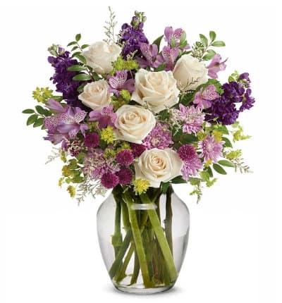 * Crème Roses
* Lavender Alstroemeria
* Purple Stock
* Purple Button Chrysanthemums
* Lavender Cushion Spray Chrysanthemums
* White Limonium
* Bupleurum
* Huckleberry
* Glass Vase