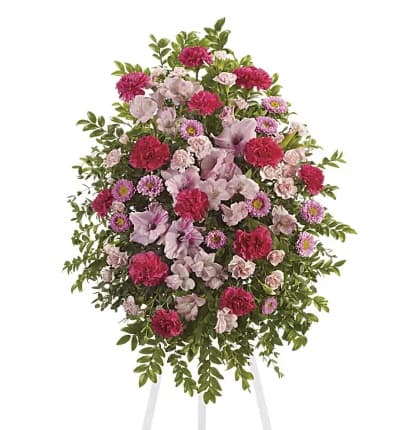  This feminine standing spray is a pink garden of alstroemeria, gladioli, carnations and asters. * Hot Pink Alstroemeria
* Gladioli
* Pink Mini Carnations
* Pink Asters