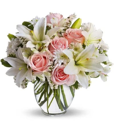 * Pink Roses
* White Asiatic Lilies
* Alstroemeria
* White Cushion Spray Mums
* Glass Vase