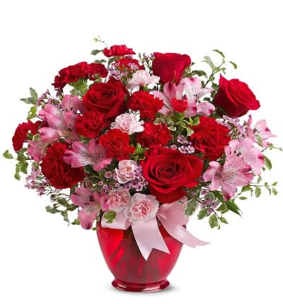 * Red Roses
* Pink Alstroemeria
* Red Carnations
* Pink Waxflower
* Red Vase with Ribbon