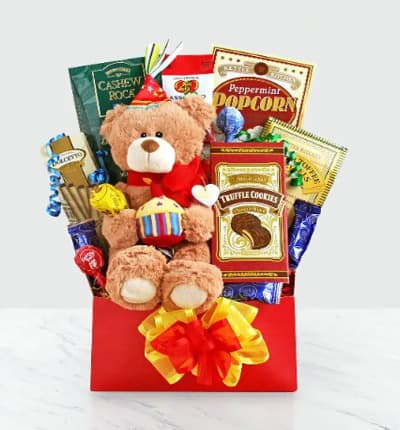 Scrumptious goodies are sure to bring a beaming smile to the lucky birthday boy or girl's face! As if that wasn't enough, these yummy snacks come with an adorable plush teddy bear. The Party Time Birthday Bear is the perfect Happy Birthday present for the little one in your life!

Includes:
* Popcorn
* Candy
* Chocolates
* Crackers
* Snacks
* Birthday Bear
* Gift Basket