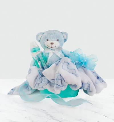 Welcome the new baby girl to the world with this adorable and memorable gift. An adorable classic gift tin comes filled with unique treasures, including a baby bottle and blue plush bear and cuddly blanket.

Includes:
* Baby Bottle
* Plush Bear
* Baby Blanket
* Gift Basket